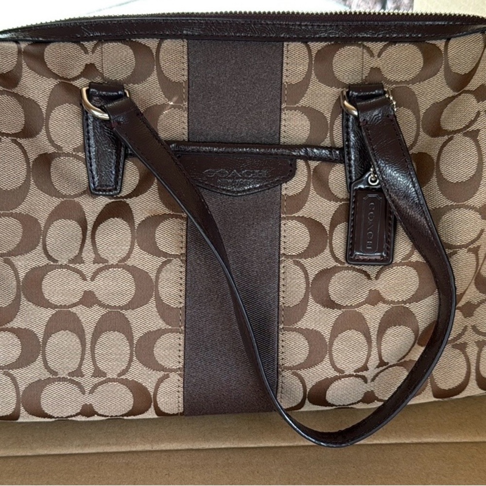 Coach Signature Satchel with two Coach hang tags. In Very good used condition.